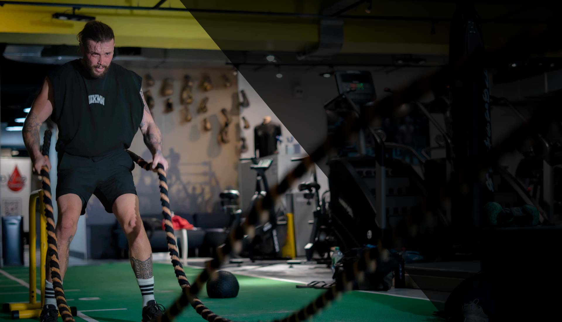 Battle ropes on green turf functional floor